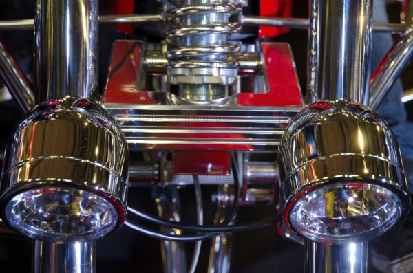 Close-up of chrome parts and headlights of a motorbike with mechanical precision, dortmund, germany