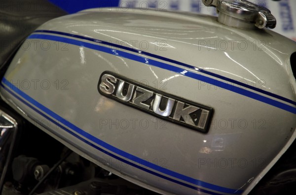 Detailed view of a Suzuki motorbike tank with blue stripes, dortmund, germany
