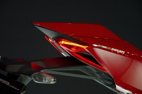 Side view of a Ducati motorbike rear end with red tail light, dortmund, germany