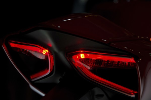 Red tail lights of a motorbike in dark surroundings, modern design, dortmund, germany