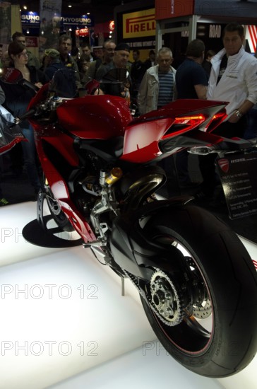 Red sports machine at a trade fair, rear view shows details of the design, dortmund, germany