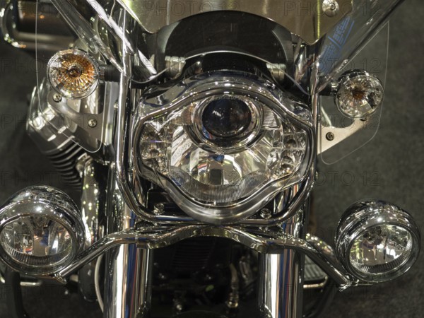Close-up of a shiny chrome headlight on a motorbike, dortmund, germany