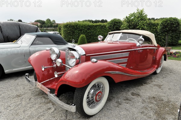 Mercedes-Benz 540K special roadster, built in 1938, classic car, red Mercedes vintage car in convertible style on a gravel road, elegant design, Retro Classics meets Baroque, Ludwigsburg, Baden-Württemberg, Germany