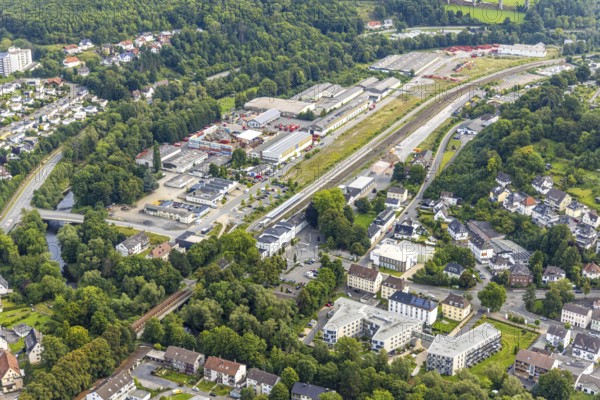 Aerial view, Arnsberg railway station, Zu den Werkstätten industrial estate, below Ruhrblick senior citizens' residence, construction site on Branddirektor-Kraemer-Straße, Obereimer, Arnsberg, Ruhr area, North Rhine-Westphalia, Germany, retirement home, old people's home, retirement home, railway premises, railway station, platform, care and nursing, DE, Deutsche Bahn AG, Europe, commercial enterprises, commercial area, commercial area, commercial property, commercial site, commercial use, railway tracks, railway tracks, industrial area, industrial site, aerial view, aerial photography, aerial photography, care facility, retirement home, retirement home, retirement home, retirement home, retirement home, retirement home centre, overview, bird's eye view, birds-eyes view, overview