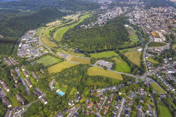 Aerial view, old town with river Ruhr Ruhrbogen at forest area Eichholz, weir and camel bridge at river Ruhr Ruhraue, truck parking, Arnsberg, Ruhr area, North Rhine-Westphalia, Germany, DE, Europe, property tax, real estate, aerial view, aerial photography, aerial photography, overview, bird's eye view, forest, forest area, residential area, housing and living, residential area, quality of living, residential area, housing estate, residential district, birds-eyes view, overview