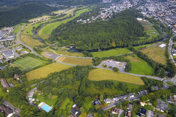 Aerial view, old town with river Ruhr Ruhrbogen at forest area Eichholz, weir and camel bridge at river Ruhr Ruhraue, truck parking, Arnsberg, Ruhr area, North Rhine-Westphalia, Germany, DE, Europe, property tax, real estate, aerial view, aerial photography, aerial photography, overview, bird's eye view, forest, forest area, residential area, housing and living, residential area, quality of living, residential area, housing estate, residential district, birds-eyes view, overview