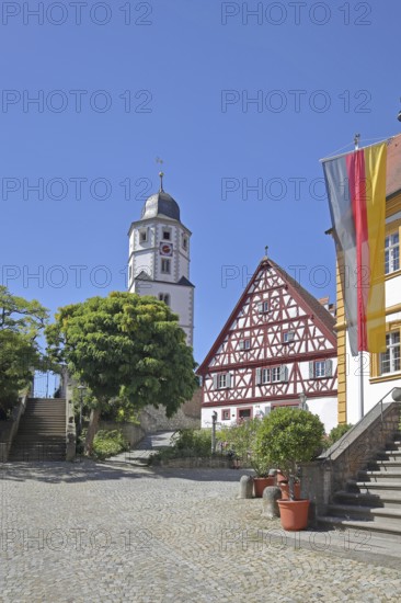 St. Nicholas Church built in 1510, cantor's house built in 1510 and baroque town hall built in 1739 with German national flag, half-timbered house, town hall square, Winterhausen, Eibelstadt, Lower Franconia, Franconia, Bavaria, Germany
