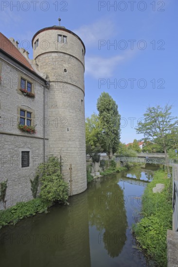 Black Tower built in the 16th century on the Breitbach, former defence defence tower of the town fortifications, reflection, Marktbreit, Lower Franconia, Franconia, Bavaria, Germany