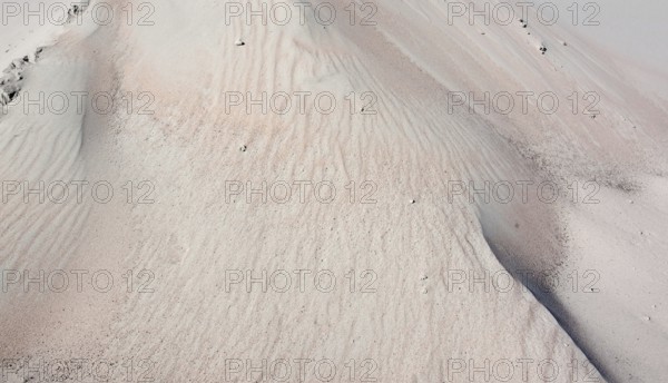 Full frame abstract sand background in sunny ambiance