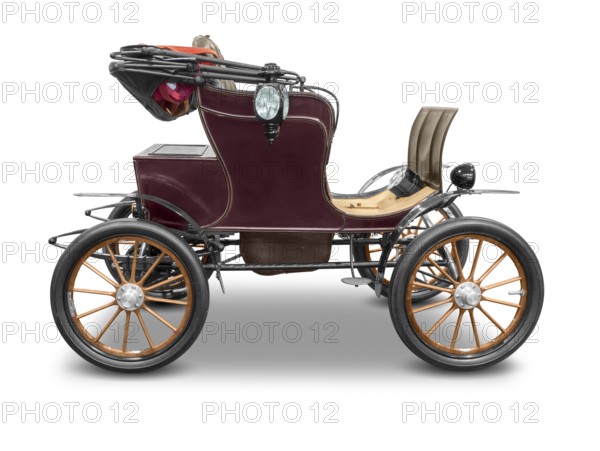 Sideways shot of a old historic electric car isolated in white back with shadow