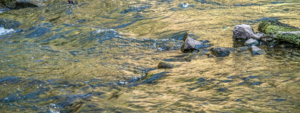 Closeup shot of some flowing water at a small river