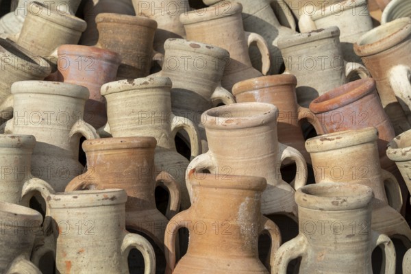 Full frame shot showing lots of sunny illuminated amphoras