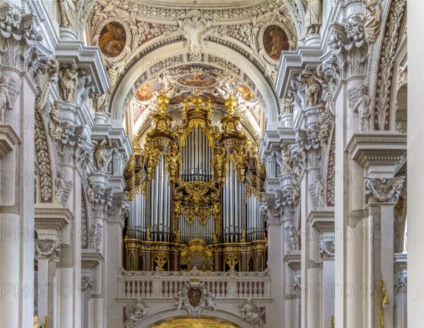 Frontal shot of a rich ornamented church organ