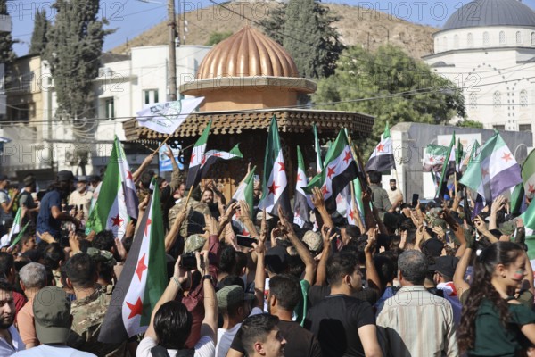 Thousands of Syrians march in Idlib carrying the Syrian revolutionary flag during a protest against international calls to normalize relations with Bashar al-Assad's regime. Aleppo, Syria. July 2, 2024, Aleppo, Aleppo, Syria