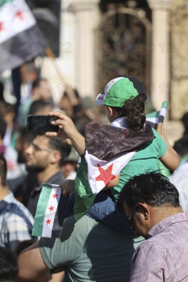 Thousands of Syrians march in Idlib carrying the Syrian revolutionary flag during a protest against international calls to normalize relations with Bashar al-Assad's regime. Aleppo, Syria. July 2, 2024, Aleppo, Aleppo, Syria
