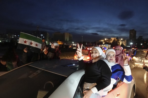 Thousands of Syrians take to public squares and main streets waving the revolutionary flag and chanting slogans to mark the downfall of Bashar al-Assad's regime and his escape to Russia. Damascus, Syria. December 8, 2024, Damascus, Damascus, Syria