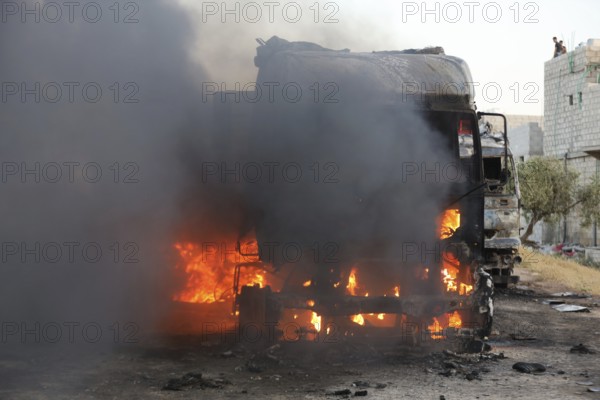 Burned trucks are seen in the opposition-held city of Azaz following shelling by forces loyal to Bashar al-Assad's regime targeting opposition areas in northern Syria. Aleppo, Syria. July 2, 2024, Aleppo, Azaz, Syria