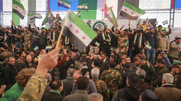 Syrians are seen demonstrating against the rule of Bashar al-Assad while carrying banners and the Syrian revolutionary flag during anti-government protests. Aleppo, Syria. July 30, 2016, Aleppo, Azaz, Syria