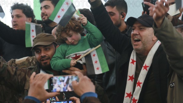 Syrians are seen demonstrating against the rule of Bashar al-Assad while carrying banners and the Syrian revolutionary flag during anti-government protests. Aleppo, Syria. July 30, 2016, Aleppo, Azaz, Syria