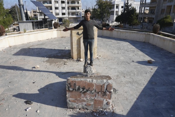 Syrians are seen destroying statues and regime symbols in Damascus after the fall of Bashar al-Assad's rule, marking the victory of the Syrian revolution. Damascus, Syria. December 18, 2024, Damascus, Damascus, Syria