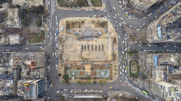 Aerial view shows Syrian public security forces staging a public parade in central Aleppo following the fall of Bashar al-Assad's regime. Crowds gathered to witness the display in the city center. Aleppo, Syria. December 2, 2024, Aleppo, Aleppo, Syria