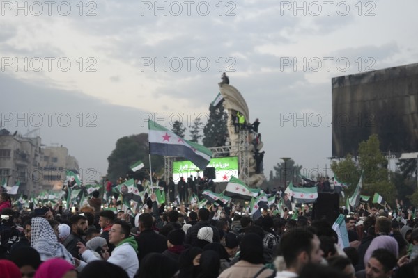 Thousands of Syrians take to public squares and main streets waving the revolutionary flag and chanting slogans to mark the downfall of Bashar al-Assad's regime and his escape to Russia. Aleppo, Syria. December 21, 2024, Aleppo, Aleppo, Syria