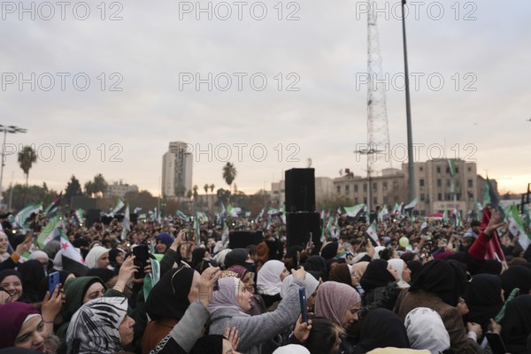 Thousands of Syrians take to public squares and main streets waving the revolutionary flag and chanting slogans to mark the downfall of Bashar al-Assad's regime and his escape to Russia. Aleppo, Syria. December 21, 2024, Aleppo, Aleppo, Syria