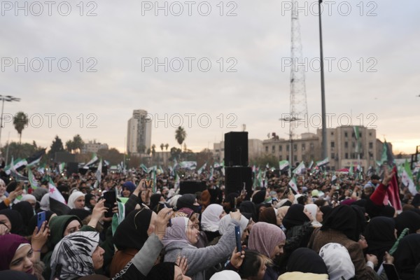 Thousands of Syrians take to public squares and main streets waving the revolutionary flag and chanting slogans to mark the downfall of Bashar al-Assad's regime and his escape to Russia. Aleppo, Syria. December 21, 2024, Aleppo, Aleppo, Syria