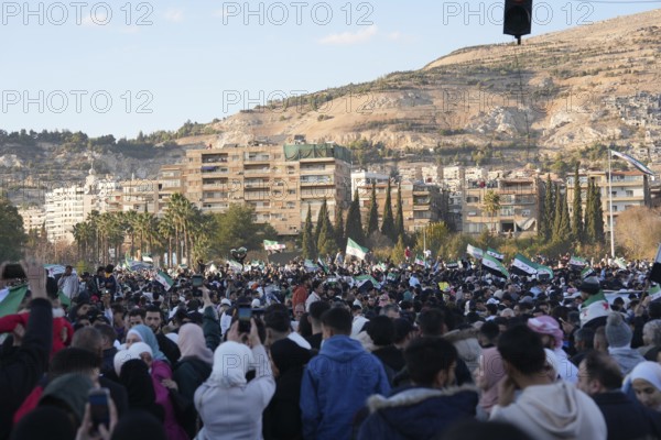 Thousands of Syrians take to public squares and main streets waving the revolutionary flag and chanting slogans to mark the downfall of Bashar al-Assad's regime and his escape to Russia. Damascus, Syria. December 8, 2024, Damascus, Damascus, Syria