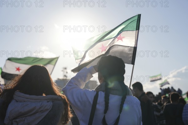 Thousands of Syrians take to public squares and main streets waving the revolutionary flag and chanting slogans to mark the downfall of Bashar al-Assad's regime and his escape to Russia. Damascus, Syria. December 8, 2024, Damascus, Damascus, Syria