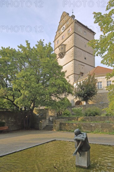 Pershore Park with spring nymph by Wilhelm Uhlig, modern art, seated nymph in the water, town gate built in 1580, landmark, Hohntor, Bad Neustadt an der Saale, Rhön, Lower Franconia, Franconia, Bavaria, Germany