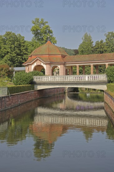 Wernarz spring temple built in 1911 and bridge over the river Sinn, temple, art nouveau, reflection, foyer, state bath, Bad Brückenau, Rhön, Bavaria, Germany