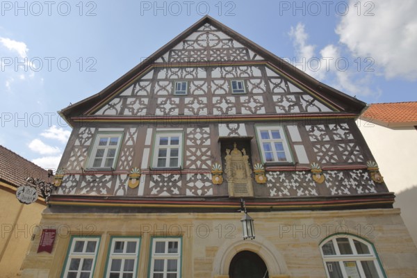 Historic Happach house, half-timbered house with decorations, gable, nose shield, Heldburg, Thuringia, Germany