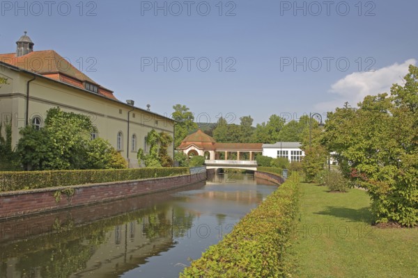 Wernarz spring temple built in 1911 and bridge over the river Sinn, temple, art nouveau, reflection, foyer, spa gardens, state bath, Bad Brückenau, Rhön, Bavaria, Germany