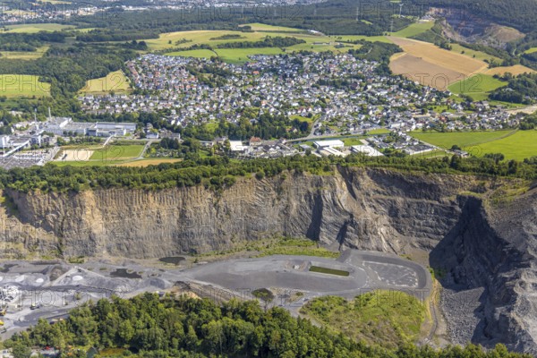 Aerial view, Heinrich Ebel GmbH quarry, Habbel plant, Habbeler Bach, residential area, Müschede district, Müschede, Arnsberg, Ruhr area, North Rhine-Westphalia, Germany, DE, Europe, property tax, real estate, aerial view, aerial photography, aerial photography, quarry, overview, bird's-eye view, residential complex, housing and living, residential area, quality of life, residential neighbourhood, housing estate, residential district, bird's-eye view, overview