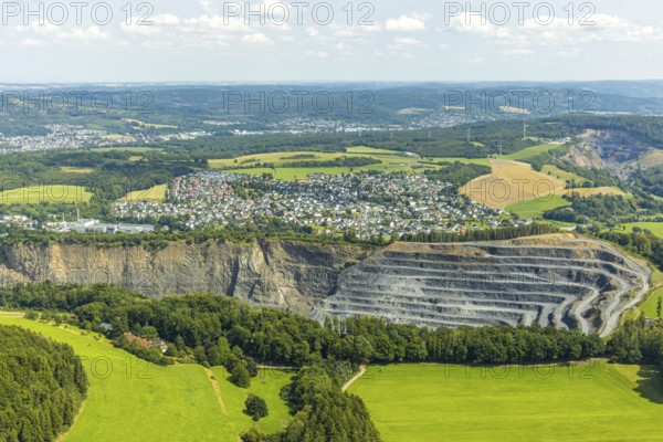 Aerial view, Heinrich Ebel GmbH quarry, Habbel plant, Habbeler Bach, residential area, Müschede district, Müschede, Arnsberg, Ruhr area, North Rhine-Westphalia, Germany, DE, Europe, property tax, real estate, aerial view, aerial photography, aerial photography, quarry, overview, bird's-eye view, residential complex, housing and living, residential area, quality of life, residential neighbourhood, housing estate, residential district, bird's-eye view, overview