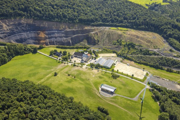 Aerial view, quarry Lanwehr Naturstein GmbH Am Langen Stück, Reit- und Fahrverein Arnsberg und Umgebung e.V. Wicheler Höhe, windmill in a meadow, Müschede, Arnsberg, Ruhr area, North Rhine-Westphalia, Germany, DE, Europe, aerial view, aerial photography, aerial photography, equestrian sports, equestrian centre, equestrian centre, equestrian centre, riding stable, riding club, quarry, overview, bird's eye view, overview