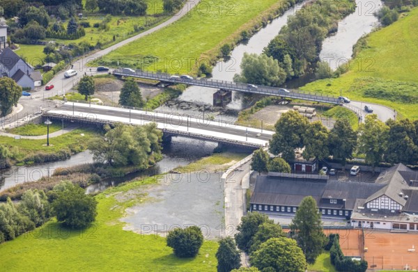 Aerial view, temporary bridge and construction site with new construction of the Dinscheder Ruhrbrücke Glösinger Straße (L735) over the river Ruhr and renaturalisation, Glösingen, Arnsberg, Sauerland, North Rhine-Westphalia, Germany, architecture, construction work, construction area, building site, building plots, construction measure, construction project, construction site, construction site vehicles, temporary bridge, bridge, bridge construction, bridge construction, bridge renovation, DE, Dinscheder Ruhrbrücke, Europe, river, river Ruhr, Glösinger Straße, Hochsauerlandkreis, infrastructure, infrastructure development, engineering, L735, landscape, aerial view, aerial photography, aerial photography, nature, new construction, region, renaturation, Ruhr area, urban development, road construction, technology, overview, environment, traffic, bird's-eye view, water body, birds-eyes view, German city, modern technology, overview, public works