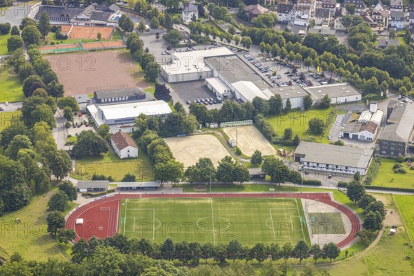 Aerial view, football stadium and athletics stadium TuS Öventrop, riding and driving club Öventrop e.V. and Ruhrtalhalle Öventrop, behind shopping centre Widayweg, Öventrop, Arnsberg, Ruhr area, North Rhine-Westphalia, Germany, DE, shopping, shopping centre, shopping markets, shopping square, shopping centre, Europe, football pitch, football stadium, football club, aerial photography, aerial photography, aerial photography, local supply centre, equestrian sports, riding facility, riding school, riding facility, riding stable, riding club, shopping centre, sports, sports facilities, sports field, sports facility, stadium, supermarket, overview, bird's-eye view, overview