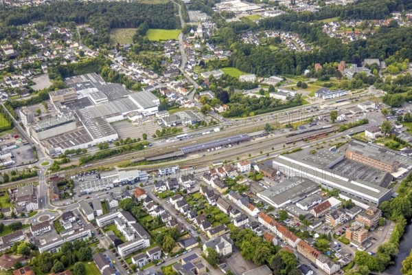 Aerial view, Hüsten railway station and Trilux GmbH factory lighting manufacturer, Hüsten, Arnsberg, Ruhr area, North Rhine-Westphalia, Germany, railway area, railway station, station forecourt, platform, DE, Deutsche Bahn AG, Europe, commercial enterprises, commercial area, commercial property, commercial location, commercial use, railway tracks, tracks, industrial area, industrial location, aerial view, aerial photography, aerial photography, overview, bird's-eye view, birds-eyes view, overview