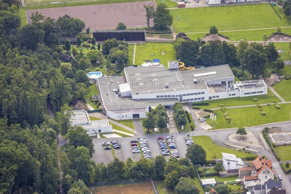 Aerial view, leisure pool NASS Arnsberg adventure pool, indoor and outdoor pool, behind the graduation house, Hüsten, Arnsberg, Ruhr area, North Rhine-Westphalia, Germany, bathing establishment, bathing resort, DE, Europe, outdoor pool, leisure activities, indoor pool, aerial view, aerial photography, aerial photography, swimming pool, swimming pool, overview, bird's-eye view, overview