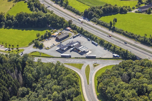 Aerial view, motorway A45 and junction Drolshagen with state road L708, with tankpool24 petrol station, hilly landscape, Germinghausen, Drolshagen, Sauerland, North Rhine-Westphalia, Germany, DE, Europe, aerial view, aerial photography, aerial photography, Ruhr area, road traffic, overview, bird's-eye view, overview