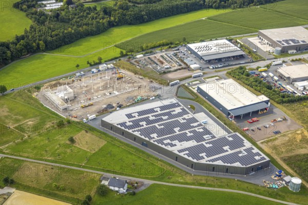 Aerial view, commercial area construction site with new building on Echthauser Straße, A.L.S Logistik GmbH with solar roof, Voßwinkel, Arnsberg, Ruhr area, North Rhine-Westphalia, Germany, DE, Europe, commercial enterprises, commercial area, commercial property, commercial location, commercial use, industrial area, industrial location, aerial view, aerial photography, aerial photography, overview, bird's-eye view, overview
