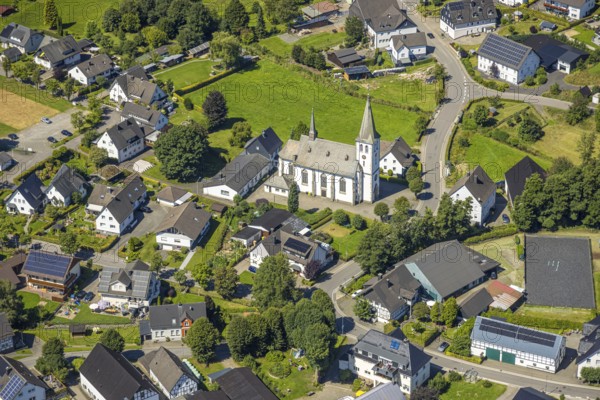 Aerial view, Church of St. Antonius Einsiedler in the village centre, Iseringhausen, Drolshagen, Sauerland, North Rhine-Westphalia, Germany, place of worship, DE, Europe, religious community, place of worship, property tax, holy place, real estate, church, parish, denomination, aerial view, aerial photography, aerial photography, religion, religious site, Ruhr area, overview, bird's eye view, residential complex, living and life, residential area, quality of life, residential quarter, housing estate, residential area, birds-eyes view, overview
