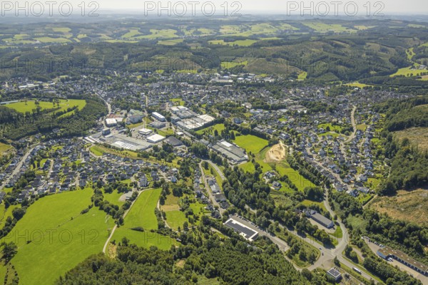 Aerial view, residential area, view of Drolshagen and wooded area and hilly landscape, commercial area, Drolshagen, Sauerland, North Rhine-Westphalia, Germany, DE, Europe, commercial enterprises, commercial area, commercial property, commercial location, commercial use, property tax, real estate, industrial area, industrial location, aerial photograph, aerial photography, aerial photography, Ruhr area, overview, bird's eye view, residential complex, living and living, residential area, residential quality, residential neighbourhood, housing estate, residential area, birds-eyes view, overview