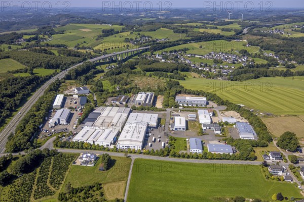 Aerial view, Scheda industrial estate and view of Bleche district on the A45 motorway and Bleche valley bridge, hilly landscape with distant view, Germinghausen, Drolshagen, Sauerland, North Rhine-Westphalia, Germany, DE, Europe, commercial enterprises, commercial area, industrial estate, commercial property, business park, commercial location, commercial use, industrial area, industrial location, aerial view, aerial photography, aerial photography, Ruhr area, road traffic, overview, bird's eye view, birds-eyes view, overview