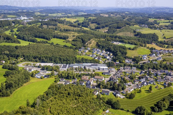Aerial view, commercial area Hauptstraße with Heinrich Huhn GmbH, primary school Hützemert, forest area with forest damage, Hützemert, Drolshagen, Sauerland, North Rhine-Westphalia, Germany, education, educational institution, DE, Europe, commercial enterprises, commercial area, commercial property, commercial site, commercial use, primary school, industrial area, industrial site, educational institute, aerial photograph, aerial photography, aerial photography, Ruhr area, school, overview, bird's eye view, birds-eyes view, overview