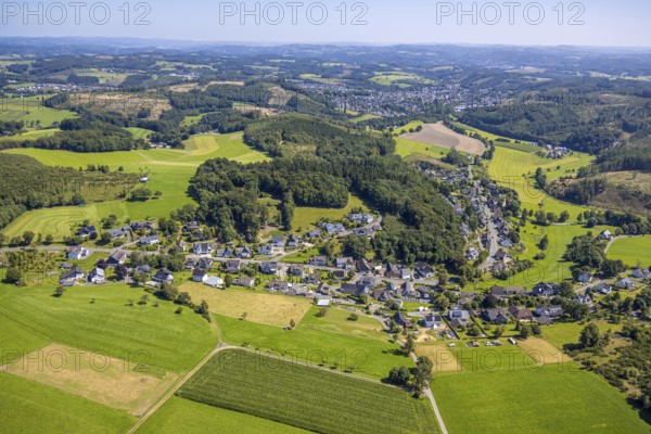 Aerial view, residential area, local view, district Benolpe, hilly landscape and distant view with local view Drolshagen, Benolpe, Drolshagen, Sauerland, North Rhine-Westphalia, Germany, DE, Europe, hilly landscape, landscape, landscape forms, aerial view, aerial photography, aerial photography, Ruhr area, overview, bird's eye view, forest, forest area, meadows and fields, birds-eyes view, green forest, overview