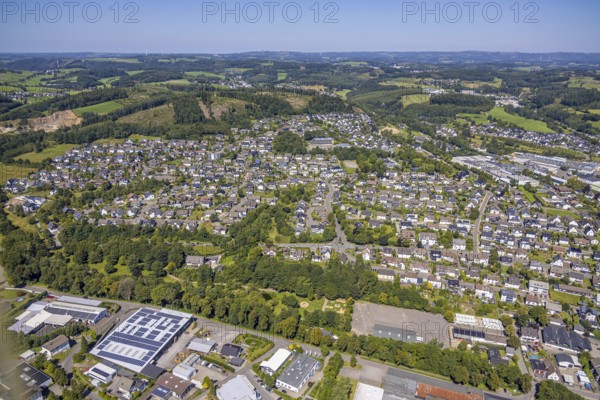 Aerial view, residential area local view Drolshagen with commercial area Bahnhofstraße, hilly landscape, Drolshagen, Sauerland, North Rhine-Westphalia, Germany, DE, Europe, commercial enterprises, commercial area, commercial area, commercial property, commercial park, commercial location, commercial use, property tax, real estate, industrial area, industrial location, aerial view, aerial photography, aerial photography, Ruhr area, overview, bird's-eye view, residential area, housing and living, residential area, residential quality, residential neighbourhood, housing estate, residential district, birds-eyes view, overview