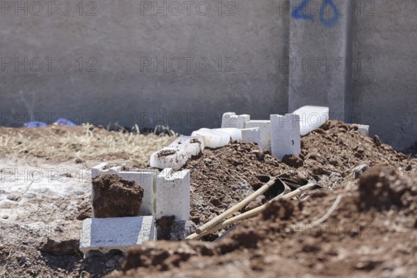 View shows a grave covered with blocks of snow in a cemetery. Azaz, Syria. July 3, 2024, Aleppo, Azaz, Syria